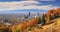Vibrant fall colors on a hill overlooking downtown. Spectacular landscape on a sunny day