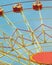 Vibrant Ferris Wheel Cabins in front of a Perfect Blue Sky. Happy Activity