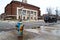 Vibrant Fire Hydrant on Rainy Day in Historic Ann Arbor Cityscape