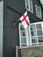 Vibrant flag of the Faroe Islands is proudly displayed on the side of a building