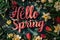 Vibrant Floral Arrangement with 3D 'Hello Spring' Text, Variety of Spring Flowers on a Dark Background