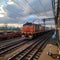 Vibrant freight trains on railway station, goods transported on colorful wagons