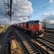 Vibrant freight trains on railway station, goods transported on colorful wagons