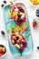 Vibrant fresh dragon fruit salad bowls on a colourful platter