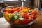 A vibrant, fresh vegetable medley, with colorful peppers, tomatoes, zucchini, and onions, artfully displayed in a glass bowl on a