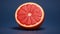 Vibrant Grapefruit On Blue Background - Stunning Uhd Image