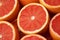 Vibrant grapefruit indulgence, close-up of sliced grapefruits