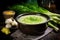 A vibrant green soup with herbs, surrounded by fresh ingredients