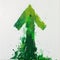 Vibrant green upward arrow, paint splatter effect. abstract art for growth concepts, creative directional sign