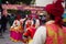 Vibrant group of performers standing outdoors in celebration of the Lok Mela festival