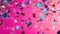 Vibrant holographic confetti falling on a bold pink background, generative ai