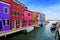 Vibrant houses along a canal in colorful Burano near Venice, Italy