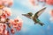 A vibrant hummingbird gracefully soars above a tree adorned with beautiful pink flowers in bloom, A hummingbird hovering near a