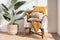 Vibrant interior scene featuring a comfy white armchair with cozy pillows and a potted green plant