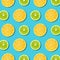Vibrant lemon and green lime slices texture on turquoise background