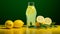 Vibrant Lemon Juice On Green Background: A Refreshing Visual Delight