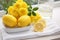 Vibrant Lemons on White Plate, Creating a Stunning and Delectable Citrus Composition.