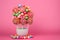 Vibrant lollipops and confections adorn a pretty pink background