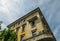 Vibrant Mediterranean colorful yellow building facade and balcony in Milan, Lombardy, Italy