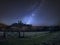 Vibrant Milky Way composite image over landscape of Medieval castle ruins