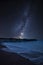 Vibrant Milky Way composite image over landscape of pier under construction and development