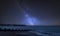 Vibrant Milky Way composite image over landscape of pier under construction and development