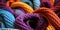 Vibrant multicolored crocheted blankets in a close up view showcasing textures and patterns in a cozy intertwined heap