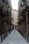 The vibrant and multicultural neighborhood of Raval in Barcelona, Spain, features narrow streets and historic architecture