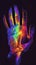 Vibrant neon colored hand in the dark