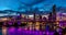 Vibrant night time panorama of Brisbane city with purple lights
