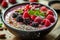 A vibrant and nutrient-packed smoothie bowl adorned with an assortment of superfoods like berries