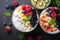 Vibrant oat granola bowl with yogurt, fruits, and nuts, top view