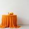 Vibrant Orange Knitted Table: Minimalist Still Life Photography