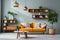 Vibrant orange sofa near blue wall with wooden cabinet and shelves. Scandinavian interior design of modern stylish living room.