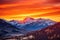 a vibrant orange sunrise over a serene mountain range