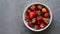 Vibrant Organic Strawberries White Dish on Muted Gray Background