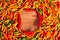 Vibrant overhead view of colorful chili peppers on a wooden table