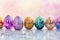 Vibrant Painted Easter Eggs Row. A row of vividly painted Easter eggs against a soft pink background