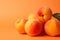 Vibrant Peaches on Orange Background AI Generated