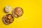 Vibrant plate of shrimp salad, crunchy chicken, bowl of rice with egg and chopsticks on yellow background. Take away food