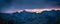 Vibrant purple and blue sky over jagged Tucson mountains at dusk.