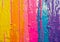 Vibrant Rainbow Paint Drips on a Wall