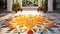 Vibrant Rangoli Artwork with Marigold Flowers and Palm Leaves in Spacious Courtyard