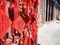 Vibrant red Chinese wishing cards hanging on a rack