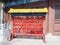 Vibrant red Chinese wishing cards hanging on a rack