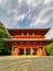 The vibrant red Daimon gate functioning as the entrance to the famous pilgrimage town Koyasan in Wakayama, Kansai, Japan