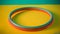 Vibrant Red And Green Hula Hoop On Colorful Surface