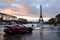 A vibrant red sports car is parked in front of the iconic Eiffel Tower in Paris, A sports car parked near the Eiffel tower, AI