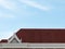 vibrant red tile roof stood proudly atop the house, its distinct color adding a touch of warmth and charm to the entire