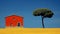 Vibrant Red And Yellow Houses With Lone Tree On Wheat Field